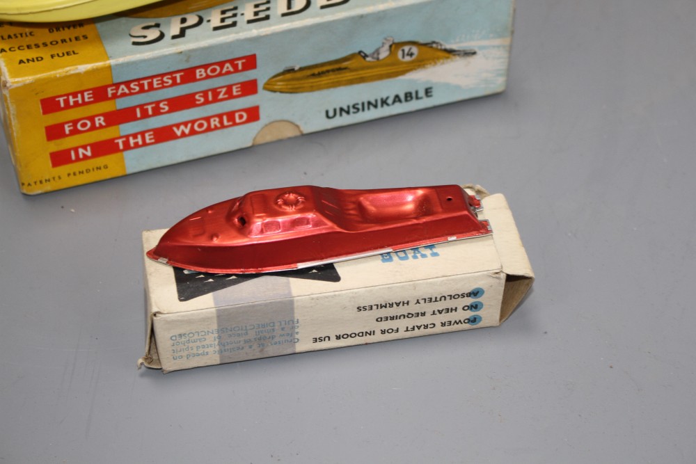 A boxed Jetex plastic fuel propelled model boat, a Jetcraft tinplate burner propelled model power boat and a boxed Mechanex pressed foi